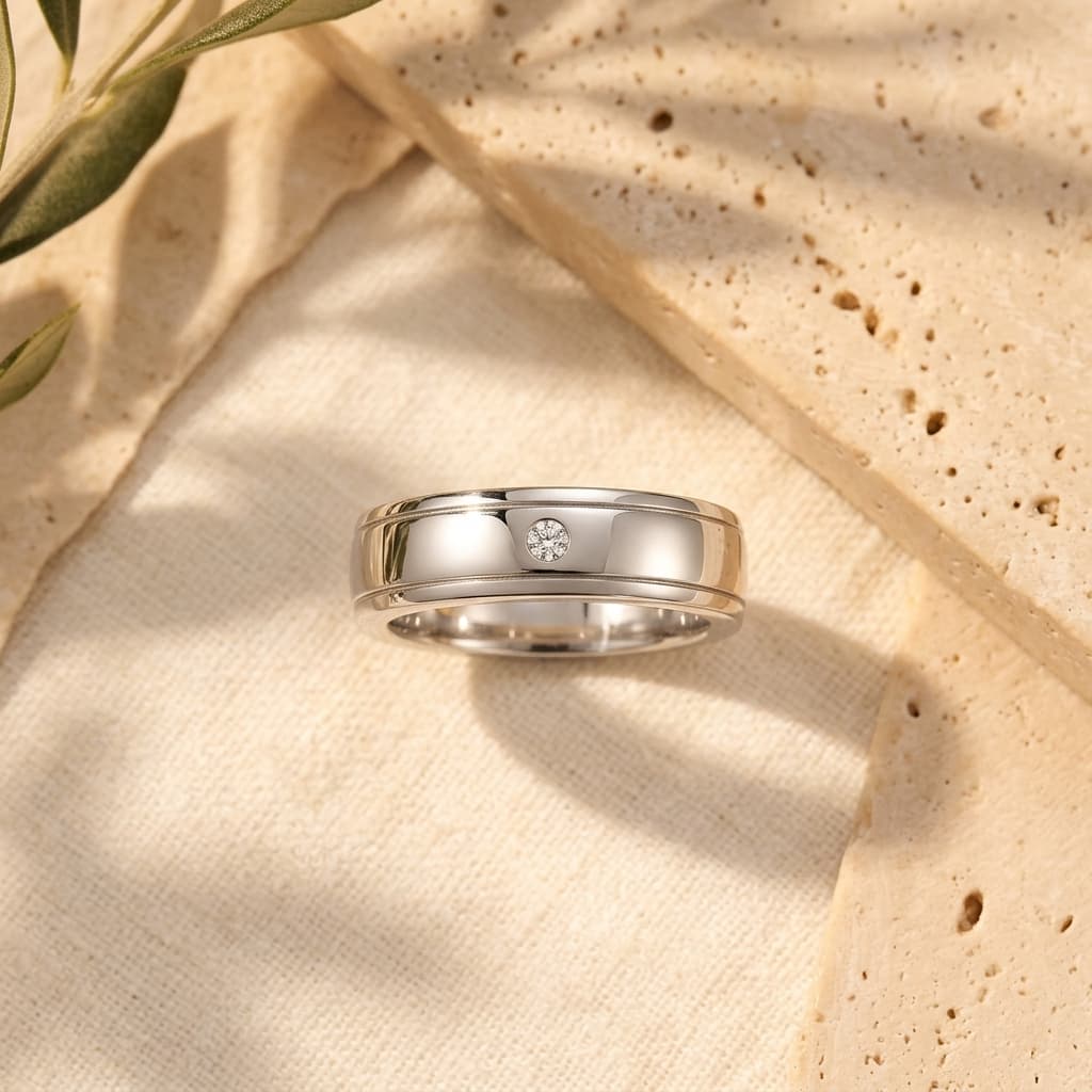 Minimalist men's S925 silver wedding ring with a flush-set D-color moissanite stone and double rail design.