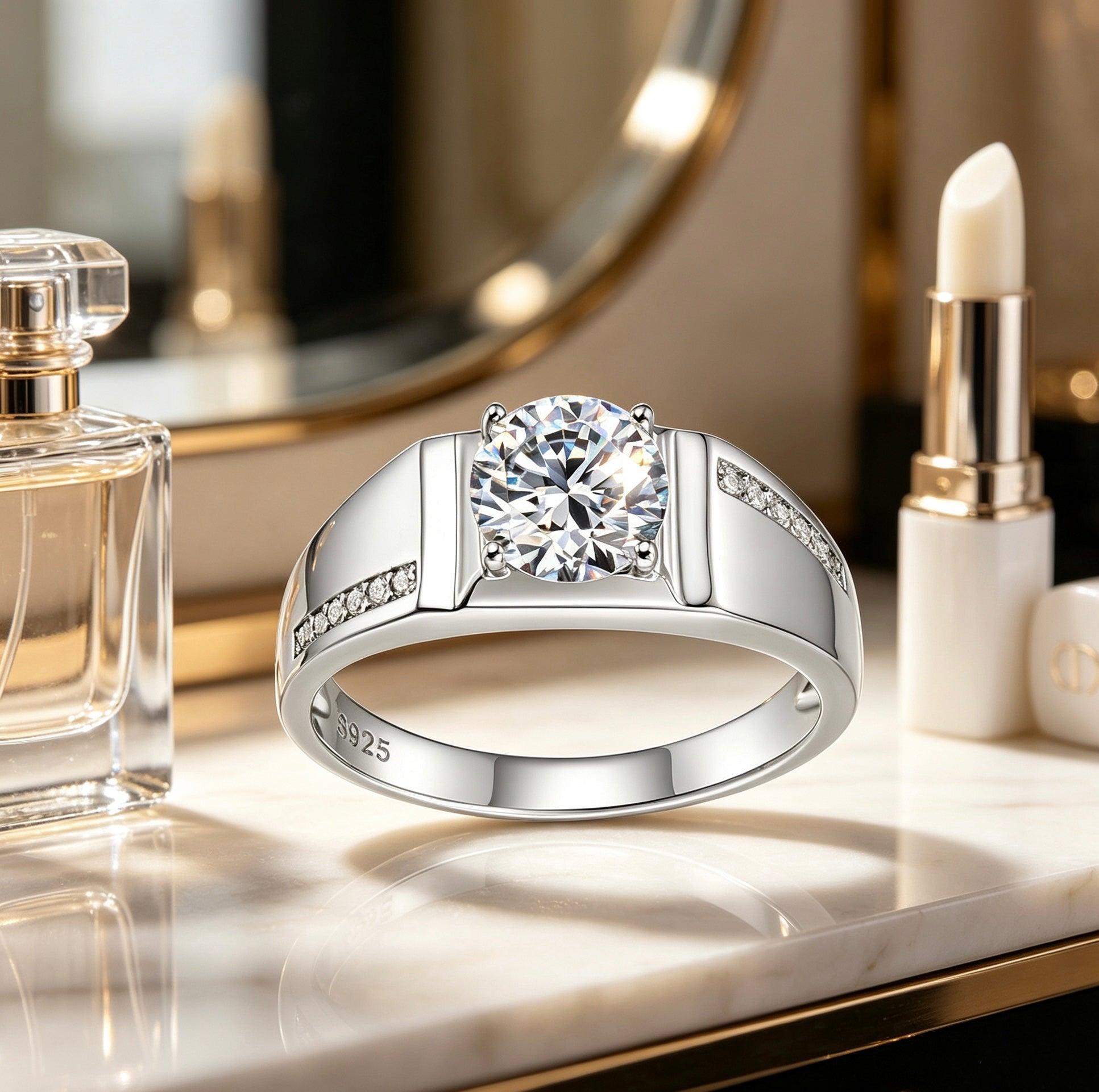1ct round moissanite men's wedding ring in S925 silver with a pavé accent band on a marble surface.