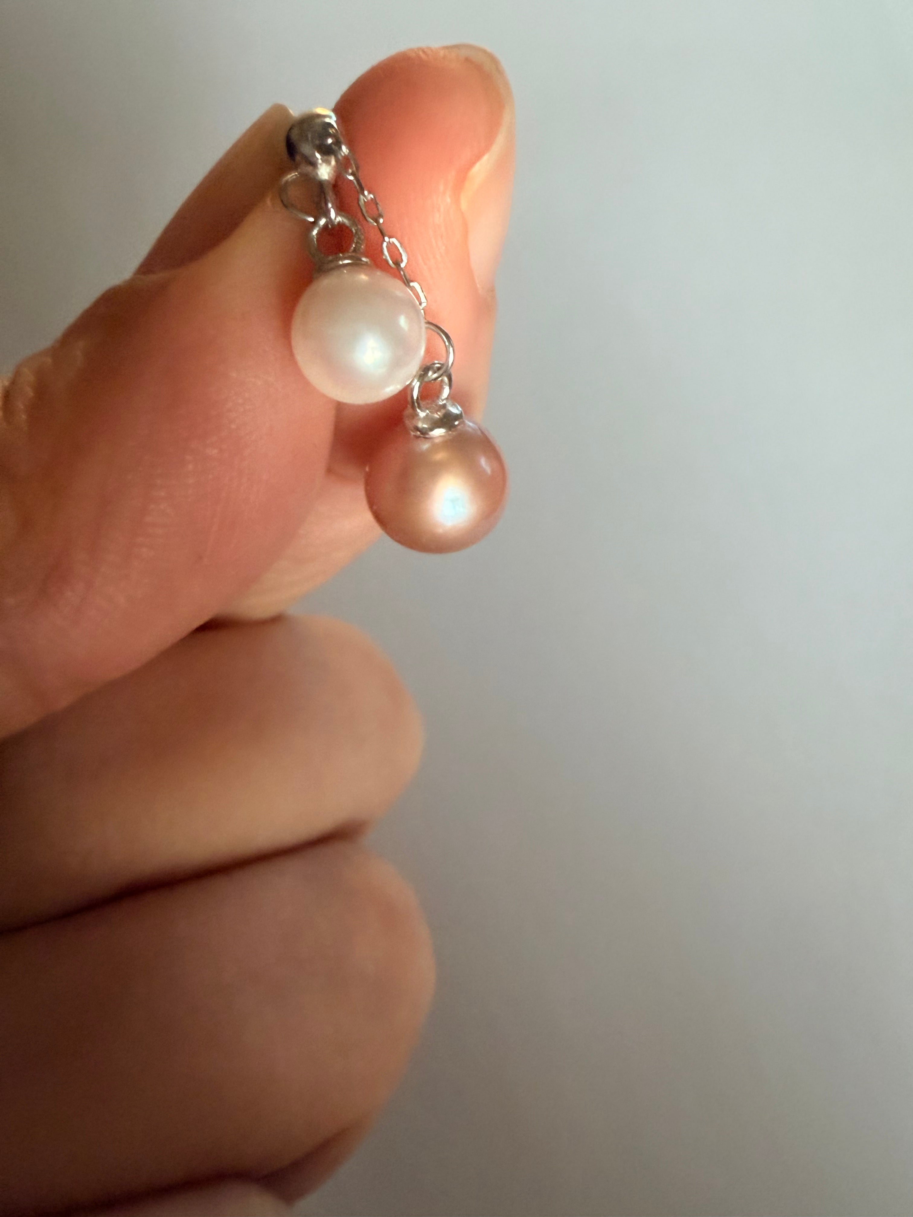 Double pearl pendant necklace with 6-7mm peach pink and 4-5mm white freshwater pearls on 925 sterling silver chain.