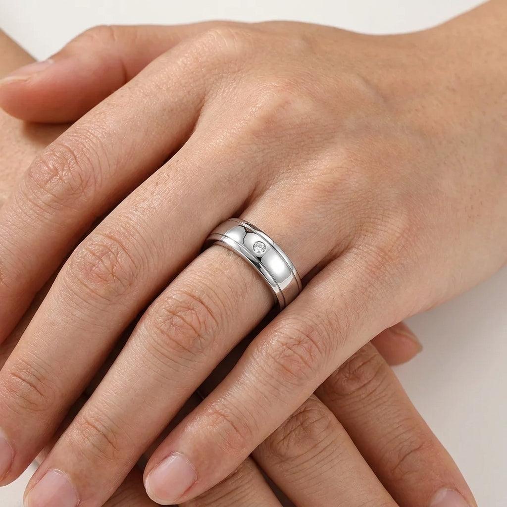 Men's S925 silver wedding ring with a 0.4ct moissanite center stone and double pavé rail design on a wide band.
