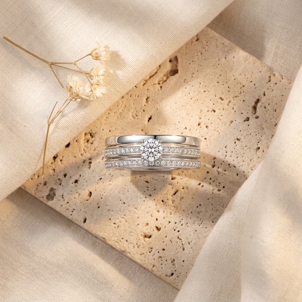 Men's wide S925 silver wedding ring with a 0.4ct moissanite center stone and double pavé moissanite rails.