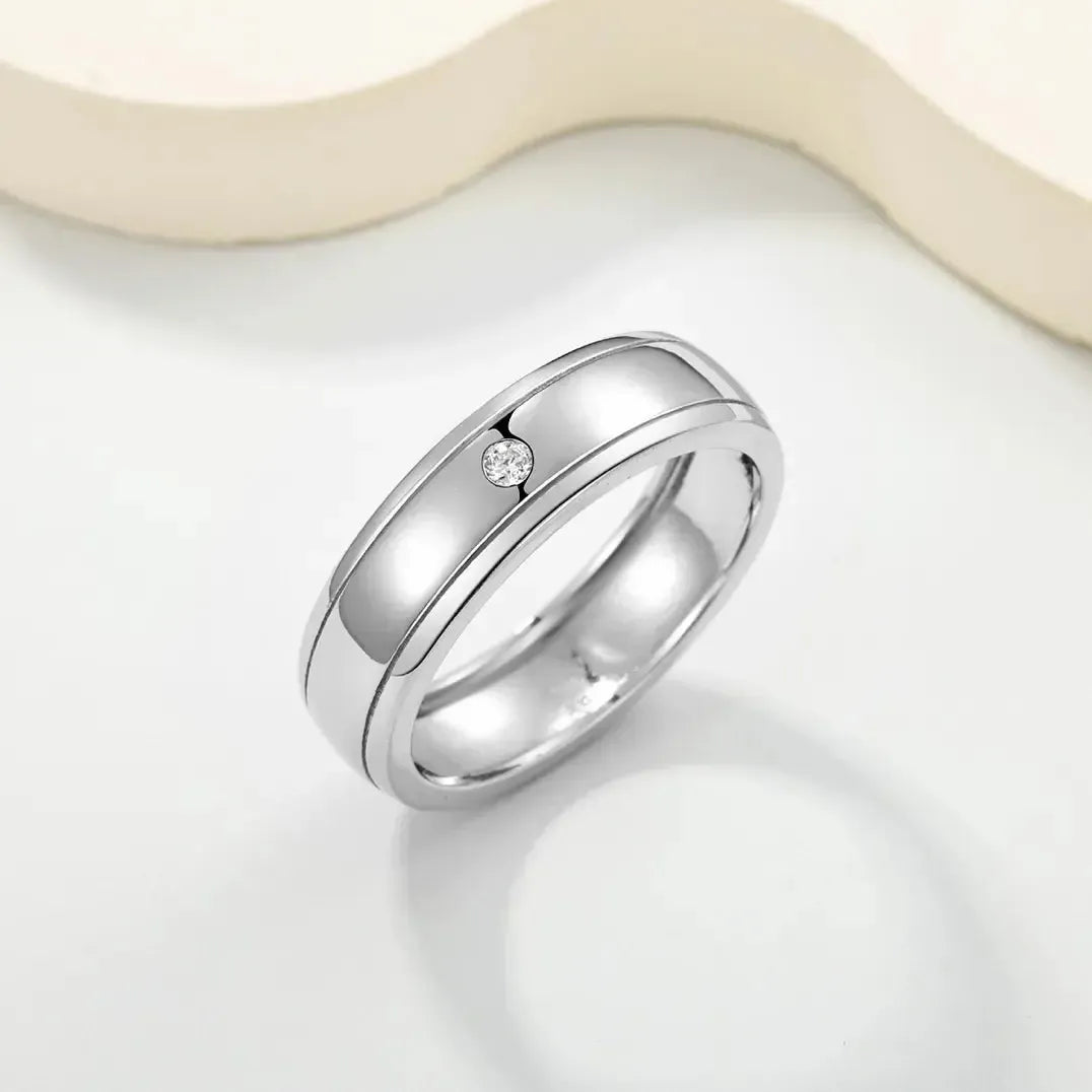Minimalist men's S925 silver wedding ring featuring a flush-set 2mm D-color moissanite stone and double rail design.