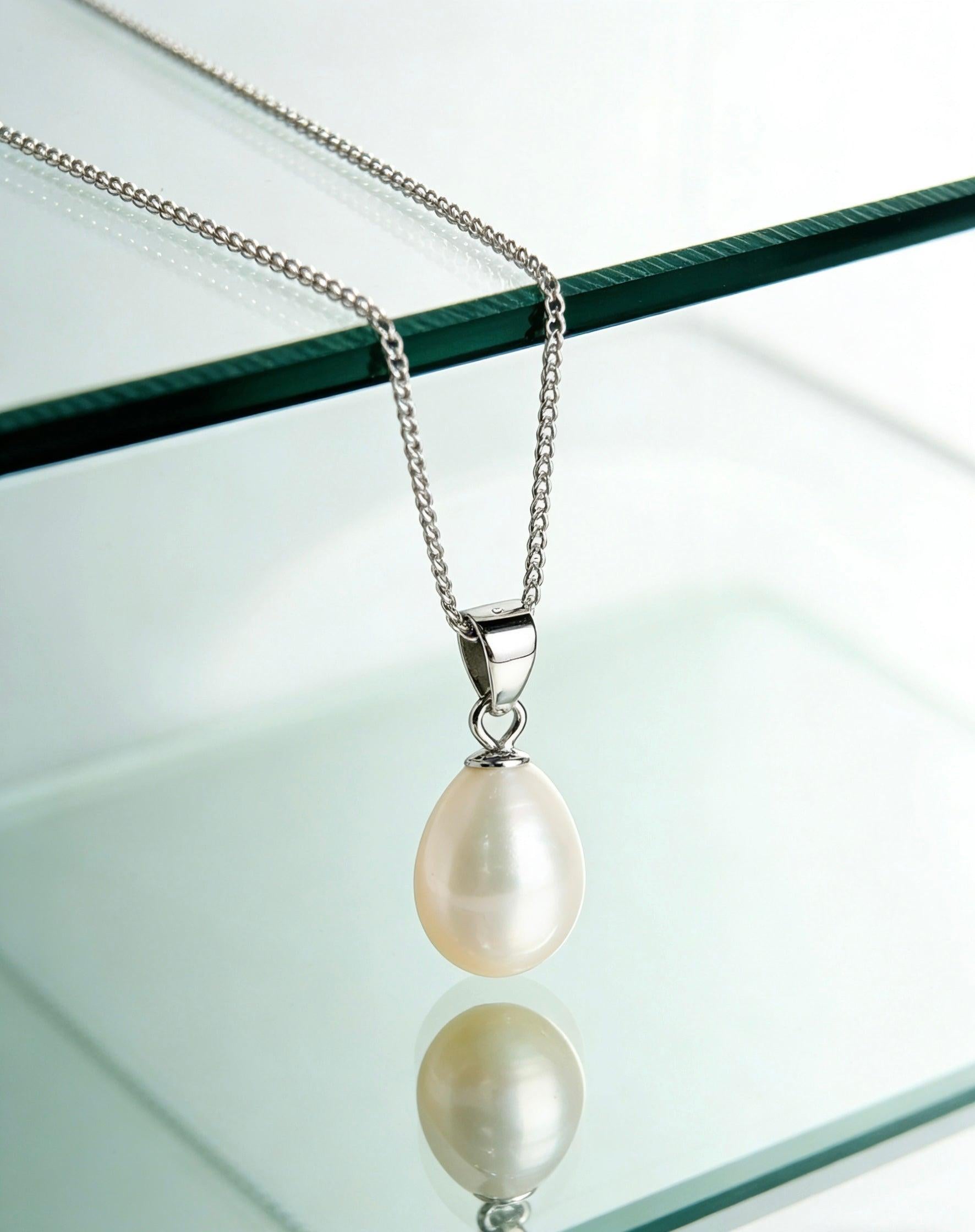 Baroque freshwater pearl pendant on a delicate 925 sterling silver chain with a soft cream-white luster.