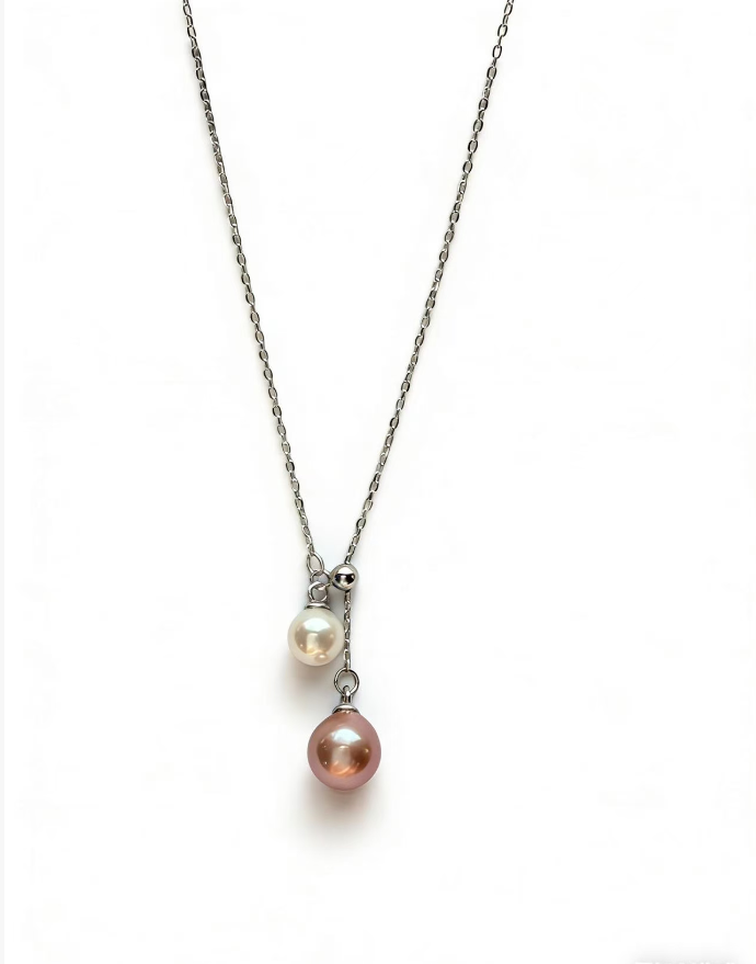 Double pearl pendant necklace with 7mm peach and 5mm white freshwater pearls on a 925 sterling silver chain.
