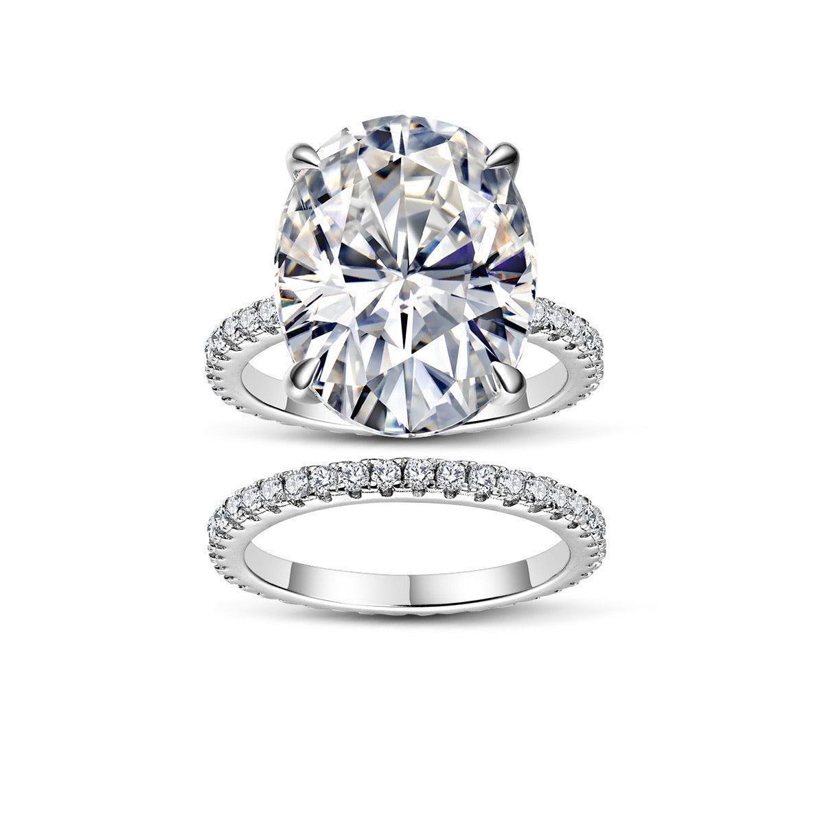 12x16mm oval moissanite bridal set in S925 silver with pavé diamond-style bands on a white background.