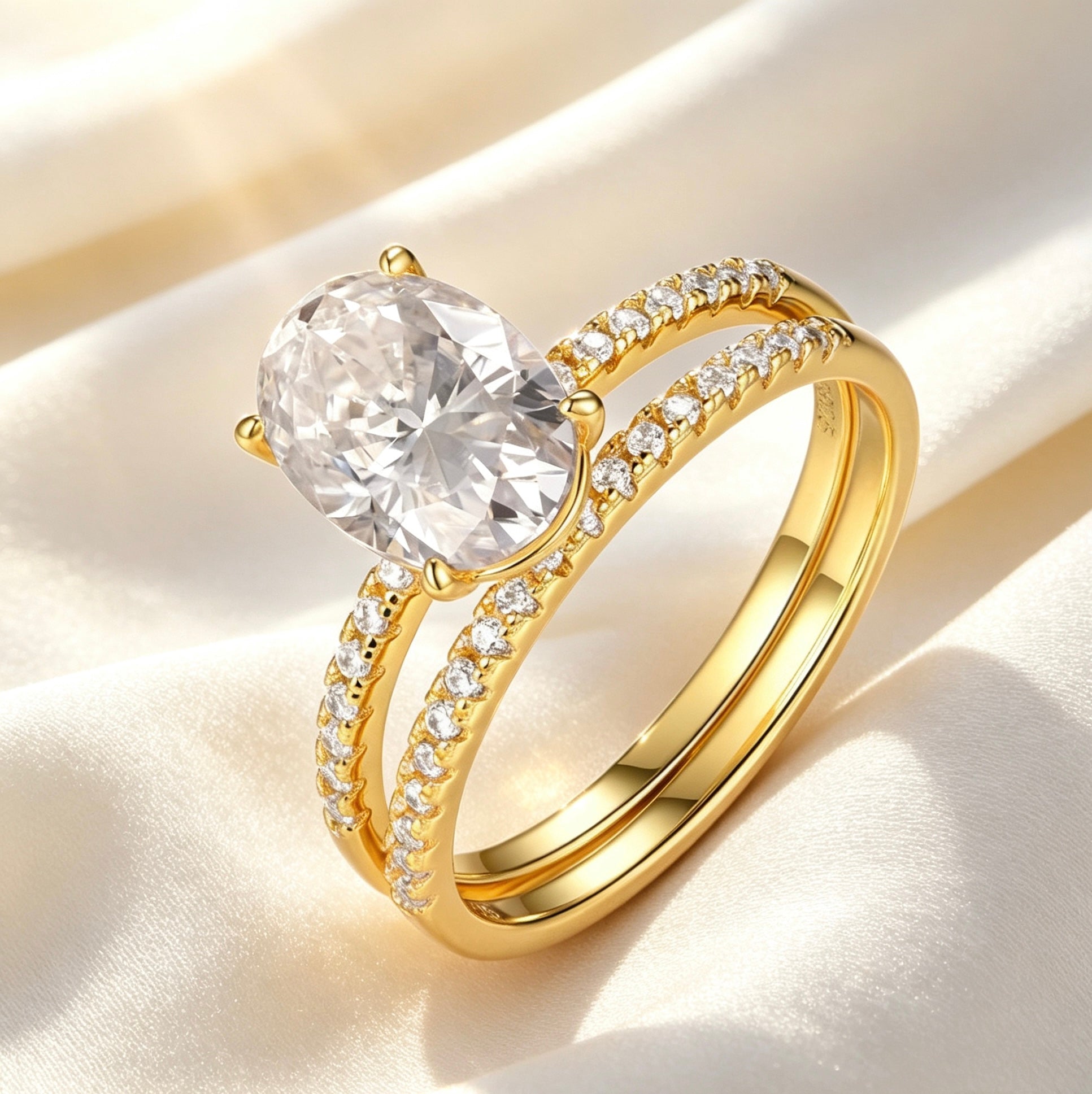 Oval moissanite solitaire engagement ring set in gold-plated S925 silver with a matching pavé diamond wedding band.