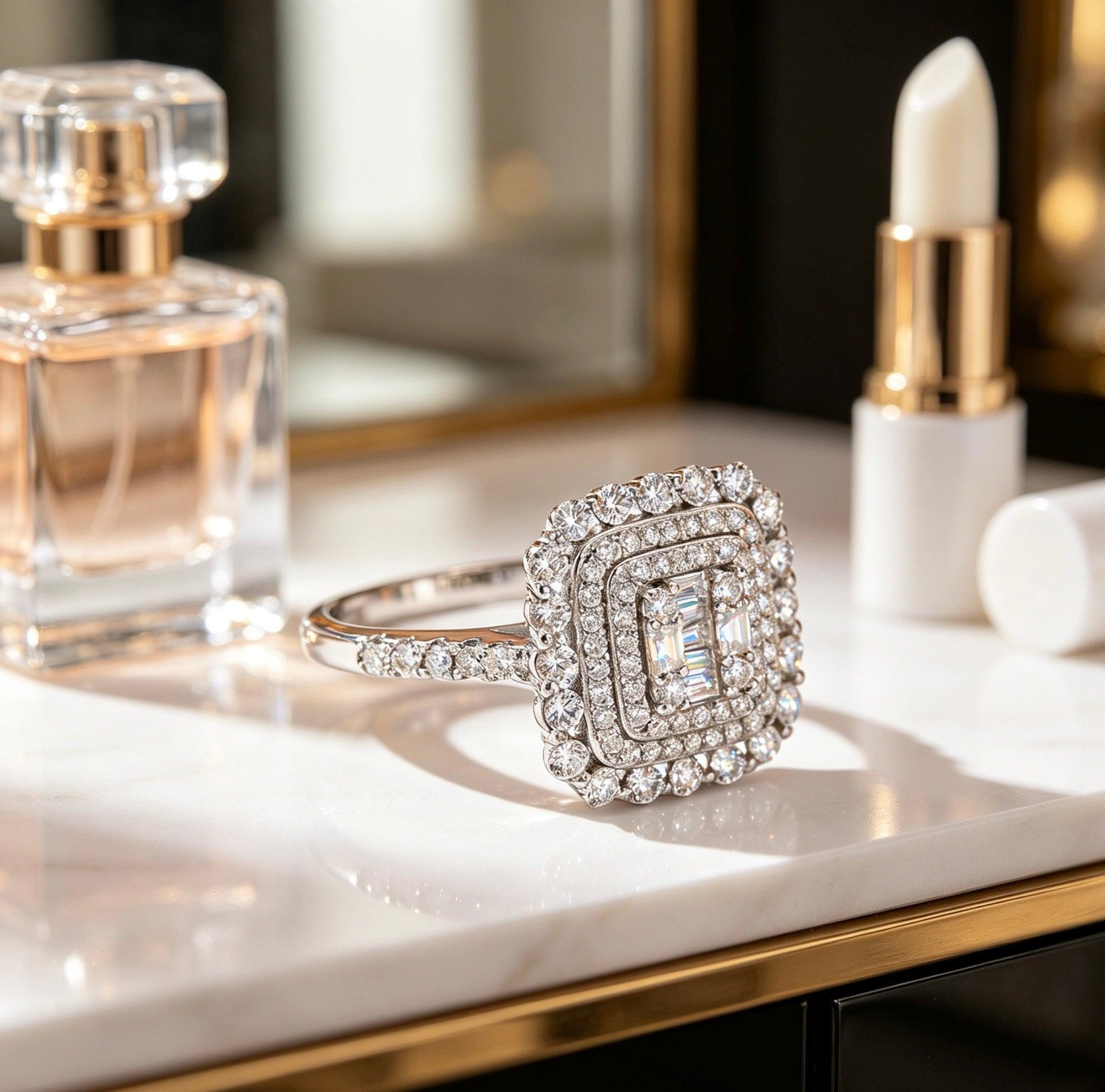 Square double halo moissanite ring in S925 silver with a baguette cluster center and pavé band on a marble vanity.