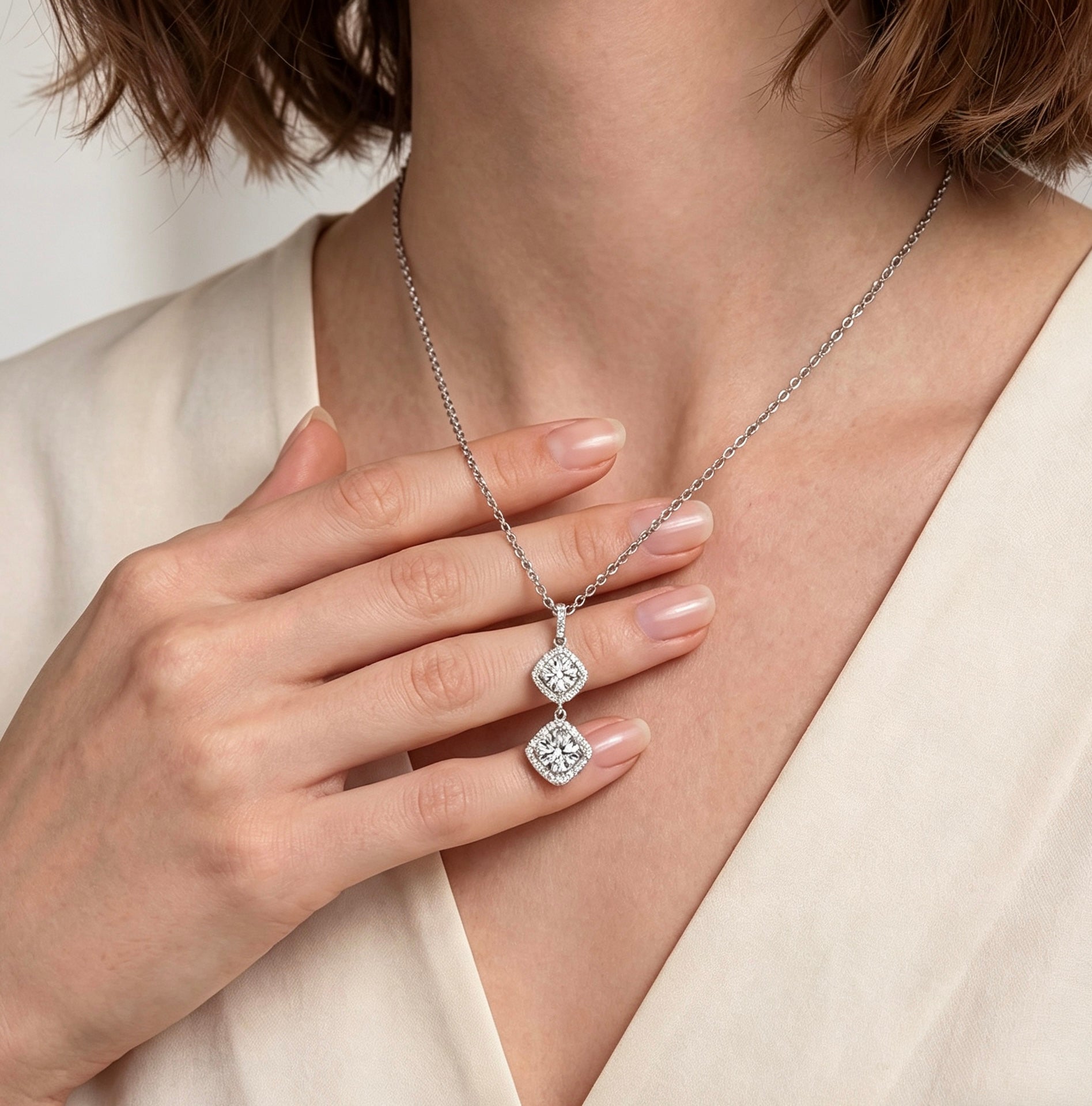 Luvymia Mother’s Halo double moissanite pendant necklace in silver, featuring two sparkling square-cut stones on a chain.
