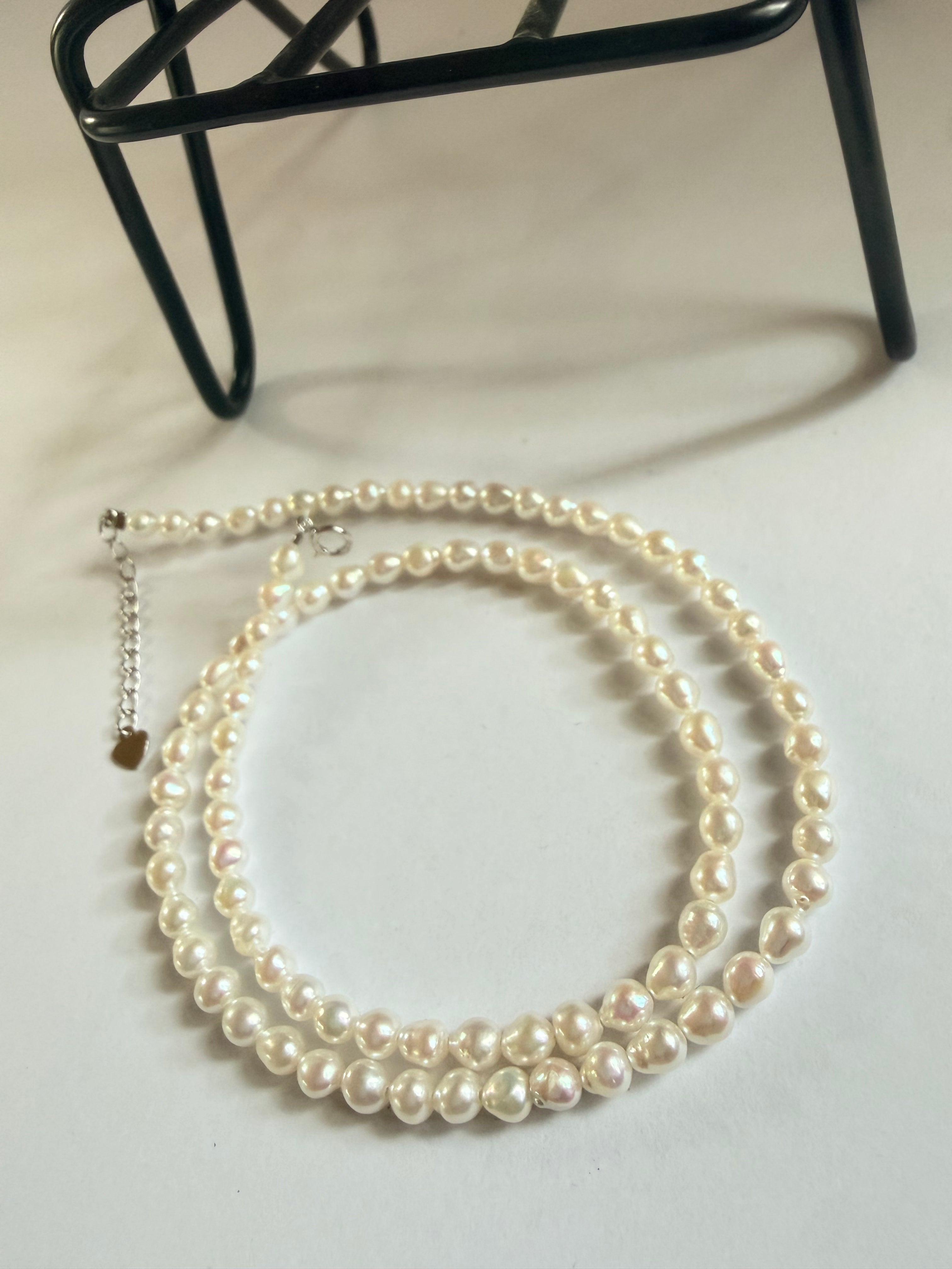 Minimalist 3–4mm baroque freshwater pearl choker necklace with 925 sterling silver clasp and extender chain.