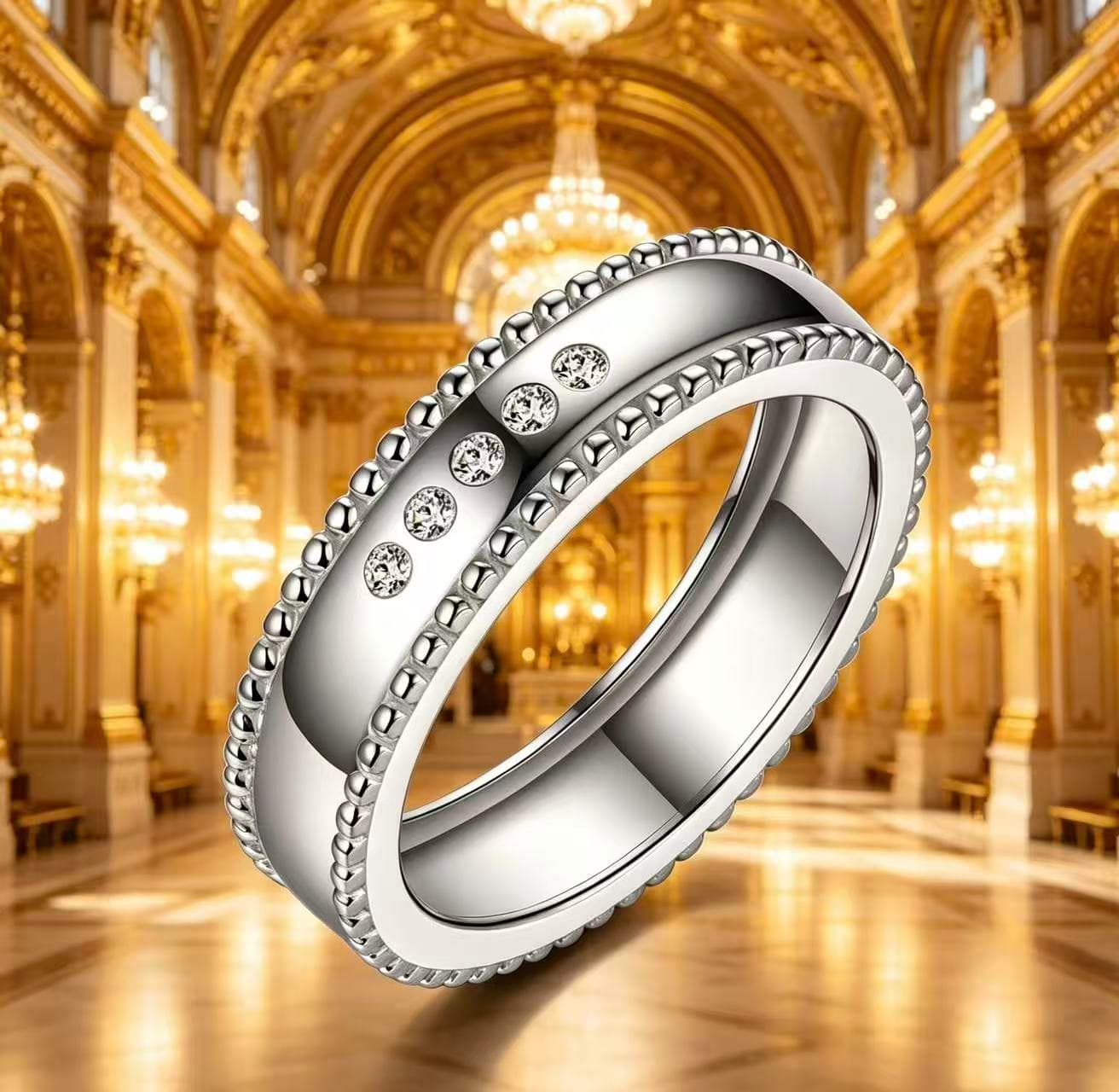 Wide silver men's wedding band with beaded edges and five sparkling moissanite stones in a luxury ballroom setting.