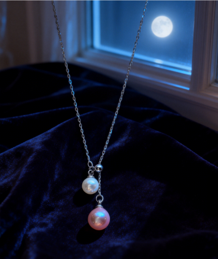 Double pearl pendant necklace with 6-7mm peach pink and 4-5mm white freshwater pearls on a 925 sterling silver chain.