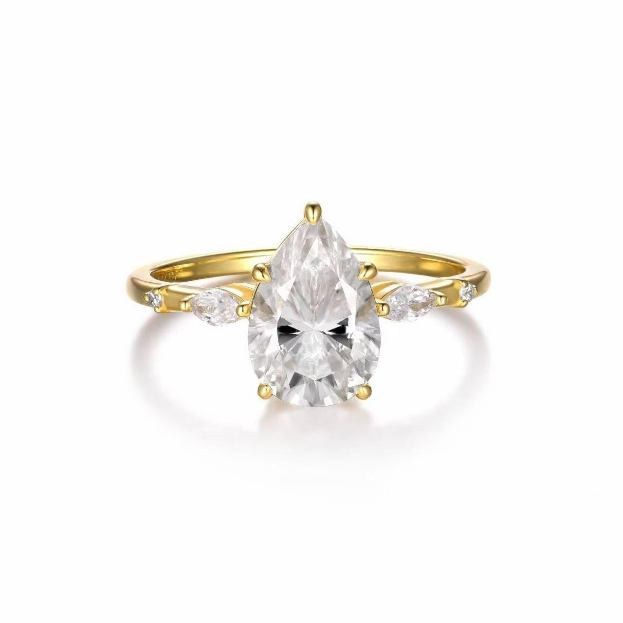 Pear-cut moissanite engagement ring in gold-plated S925 silver with scattered marquise and round petal accents.