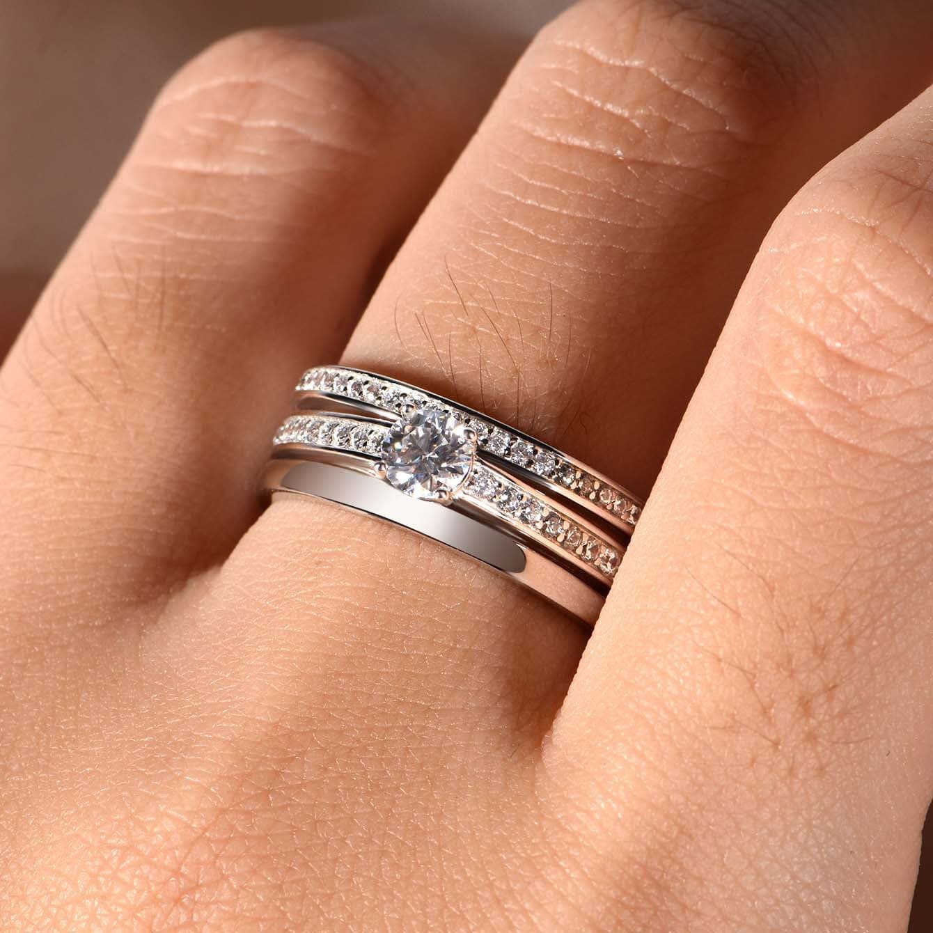 Men's S925 silver wedding ring featuring a 0.4ct round moissanite center stone and double pavé moissanite rails.